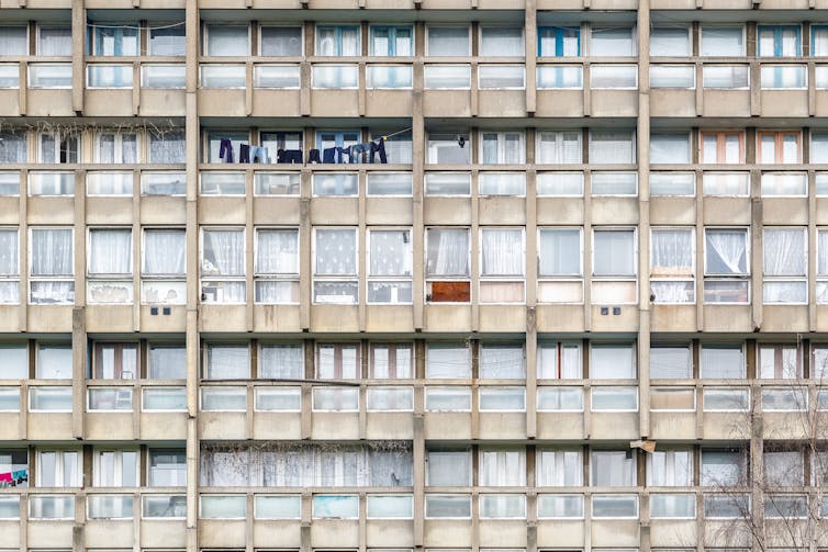 The side of a block of council flats in disrepair in London
