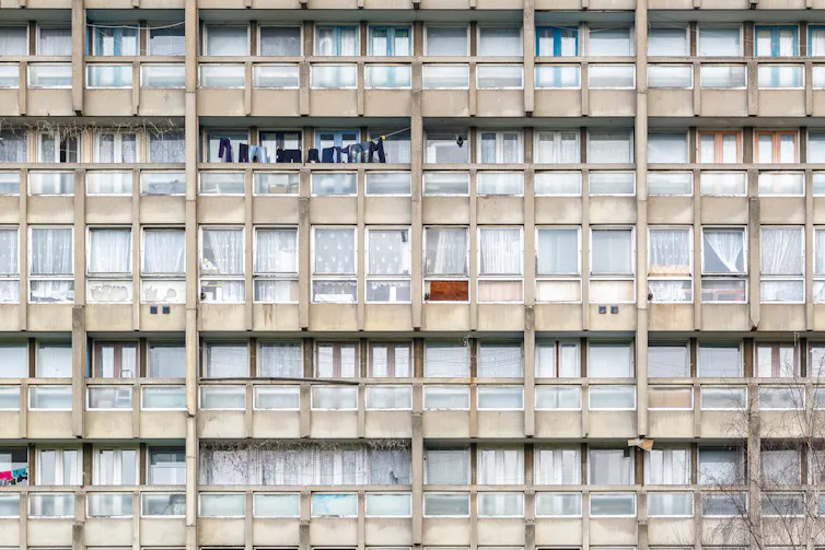 The side of a block of council flats in disrepair in London