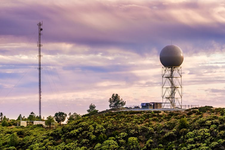 Sunset view of a weather radar station.