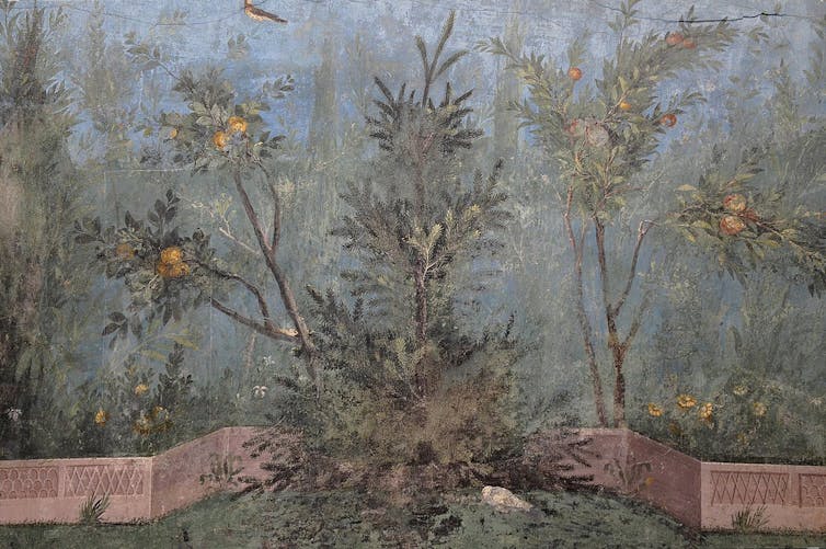A fresco showing a garden scene with fruits, flowers and birds against the backdrop of a blue sky