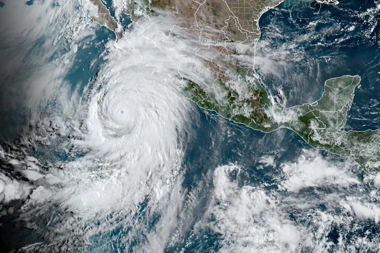 A satellite image shows a large hurricane off Mexico