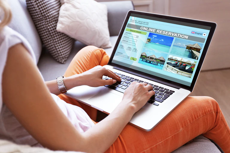 Using laptop to make an online reservation