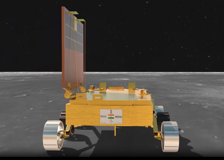 A boxlike rover with 6 wheels and a large solar power array.