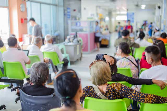Patients sitting in hospital waiting room