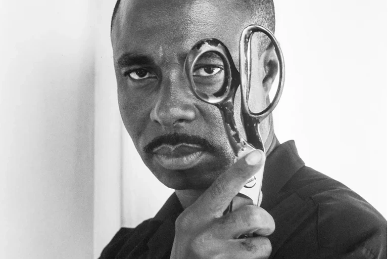 A man holding a pair of scissors