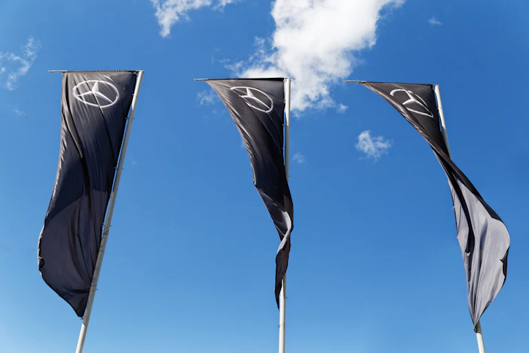 Mercedes-Benz banners at a car dealership.