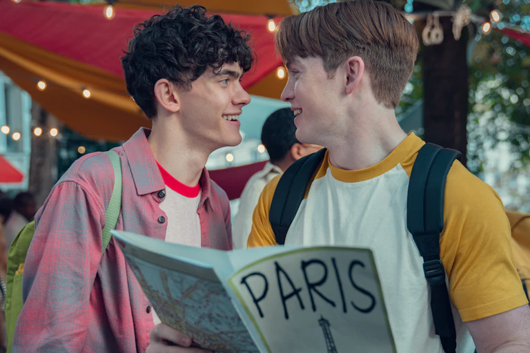Teenage boys looking at each other happily