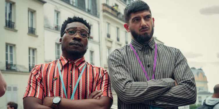 Two men looking disapproving with arms crossed