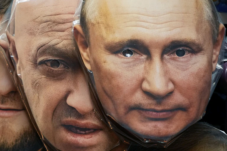 face masks showing the faces of two men