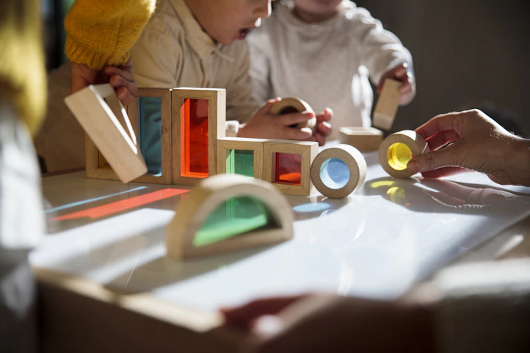 children play with blocks on table