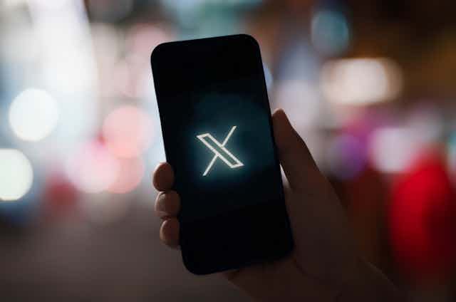 Image of X on a smartphone screen.