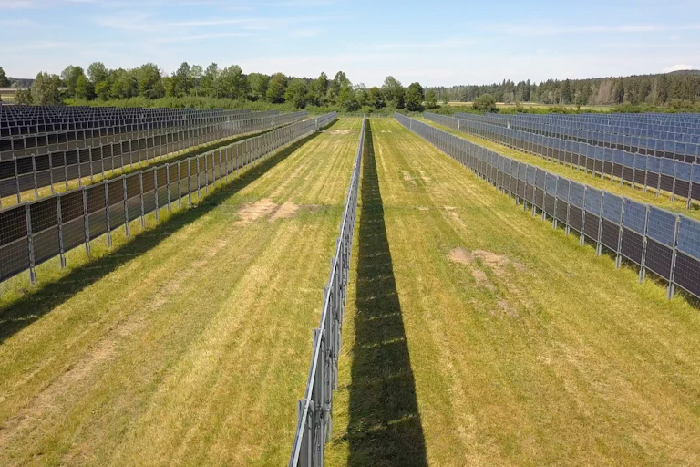 Aasen agrivoltaics solar plant with walls of vertical bifacial modules near Donaueschingen Germany, which allow conventional farming between the rows.