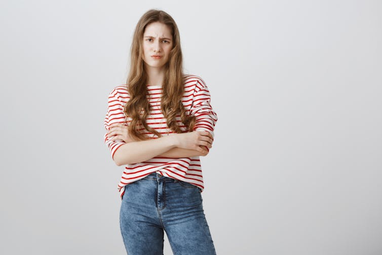 Young woman looking annoyed