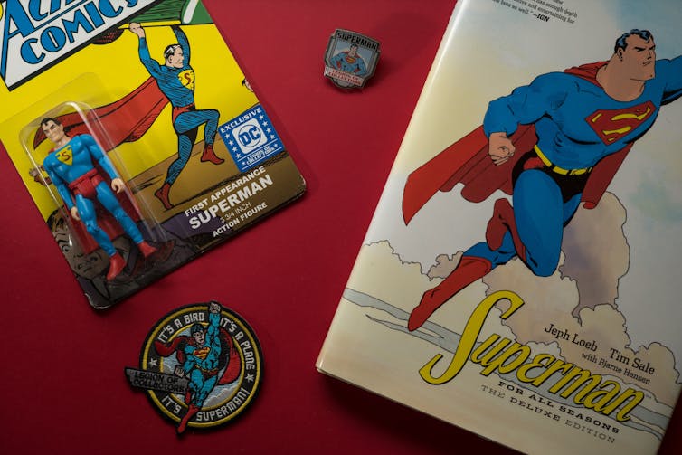 A superman comic and badge.