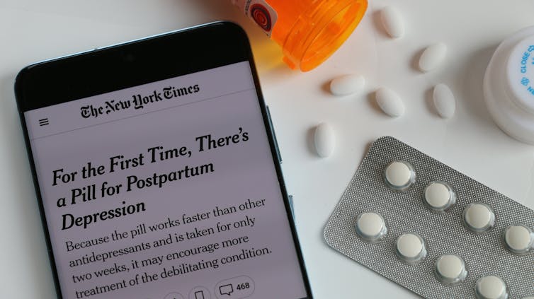 Photo of a smartphone screen displaying a New York Times story about a new PPD medication