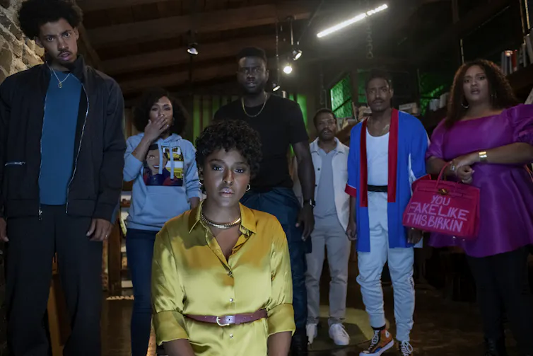A group of friends stare into the camera.