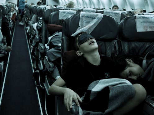 How can I get better sleep on long-haul flights?