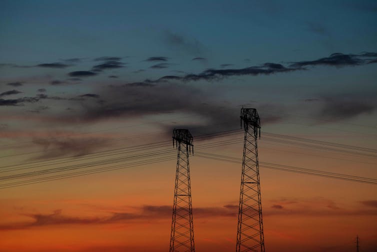 Electricity pylons against a German sunset