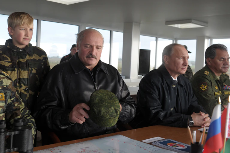Belarus president Alexander Lukashenko with Vladimir Putin and Russian army officers.