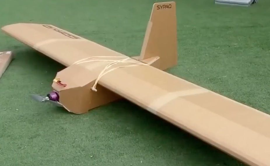 A cardboard drone shaped like a conventional aeroplane