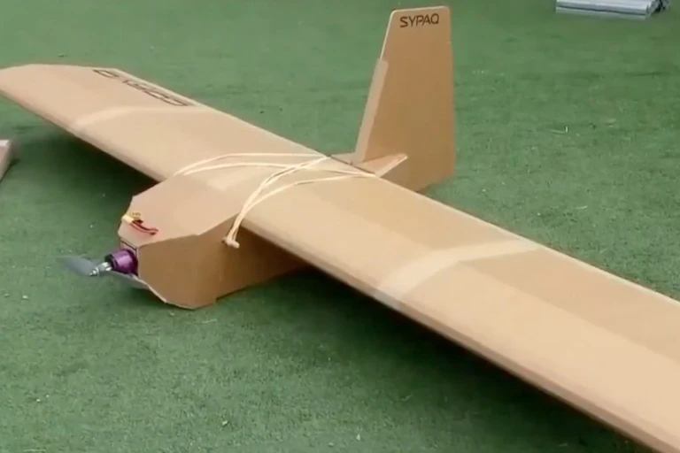 A cardboard drone shaped like a conventional aeroplane