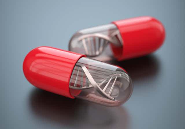 Illustration of two red pill capsules with DNA inside them