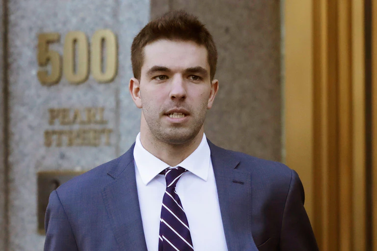 Man in suit leaving court