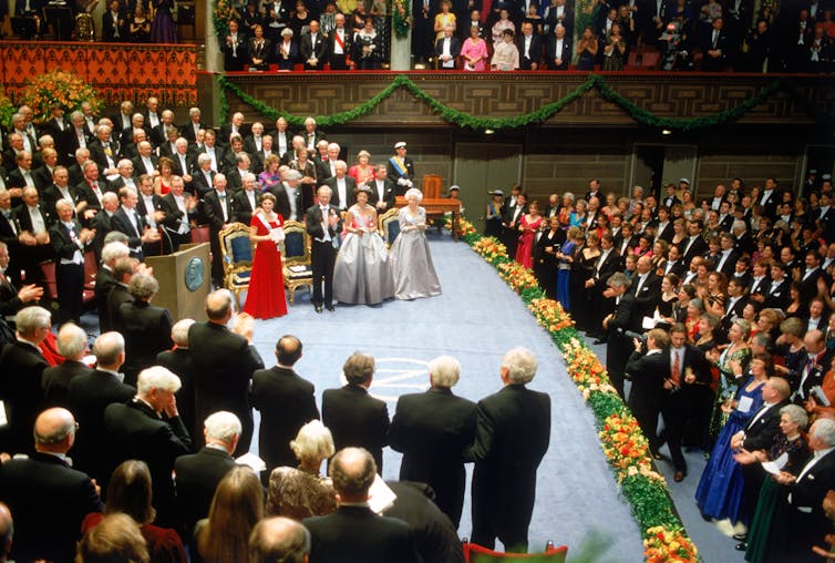 People applaud at the Nobel prize ceremony.