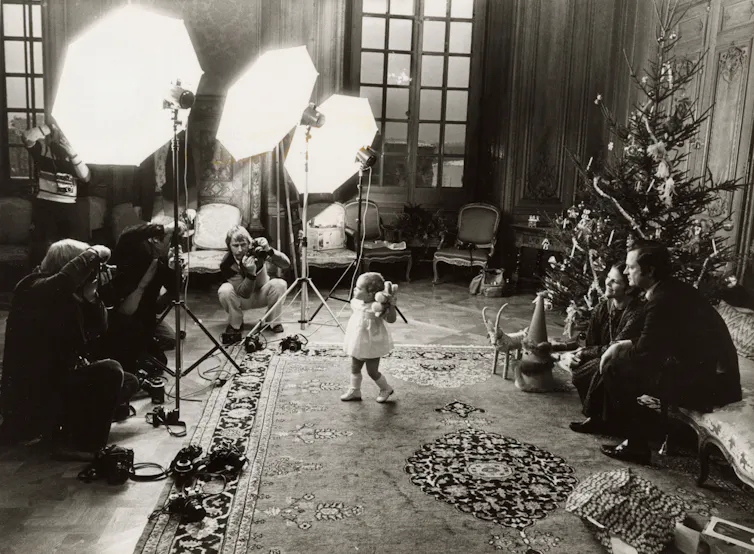A photoshoot takes place in a royal palace.