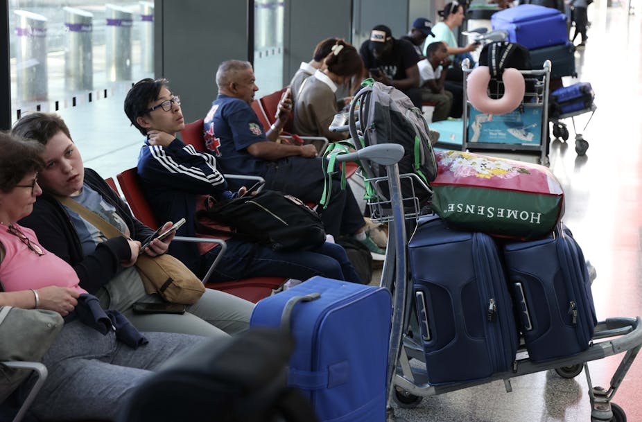 Passengers wait in a departure lounge at Heathrow Airport in London, Britain, 28 August 2023.