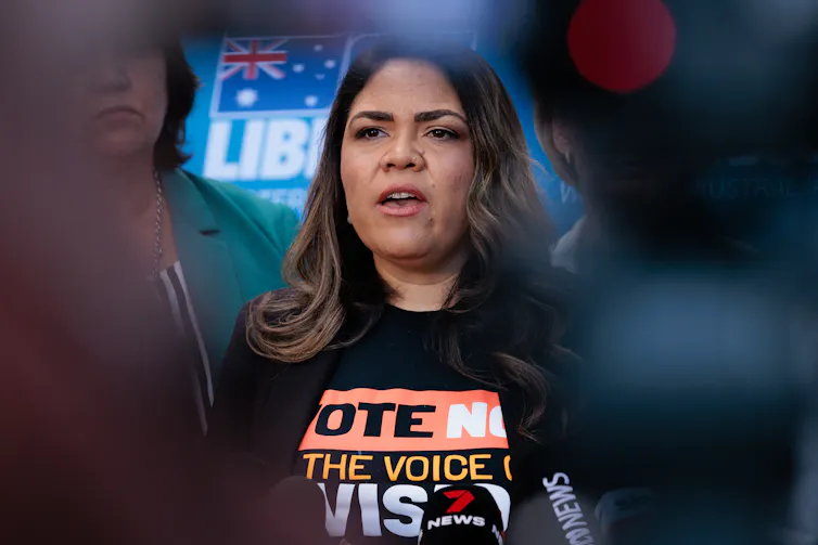 Price in a 'vote no' t-shirt.