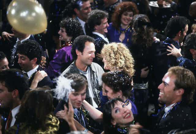 Meg Ryan and Billy Crystal dancing at a New Year's Eve party in a scene from When Harry Met Sally.