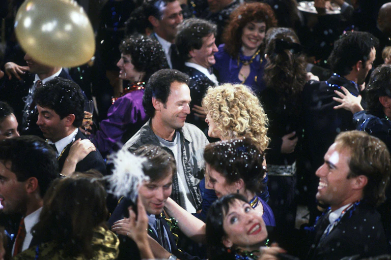 Meg Ryan and Billy Crystal dancing at a New Year's Eve party in a scene from When Harry Met Sally.