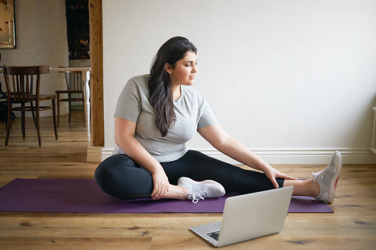 A woman stretches.