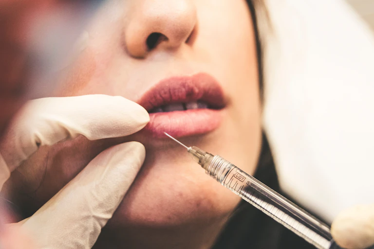 woman gets injection in lip