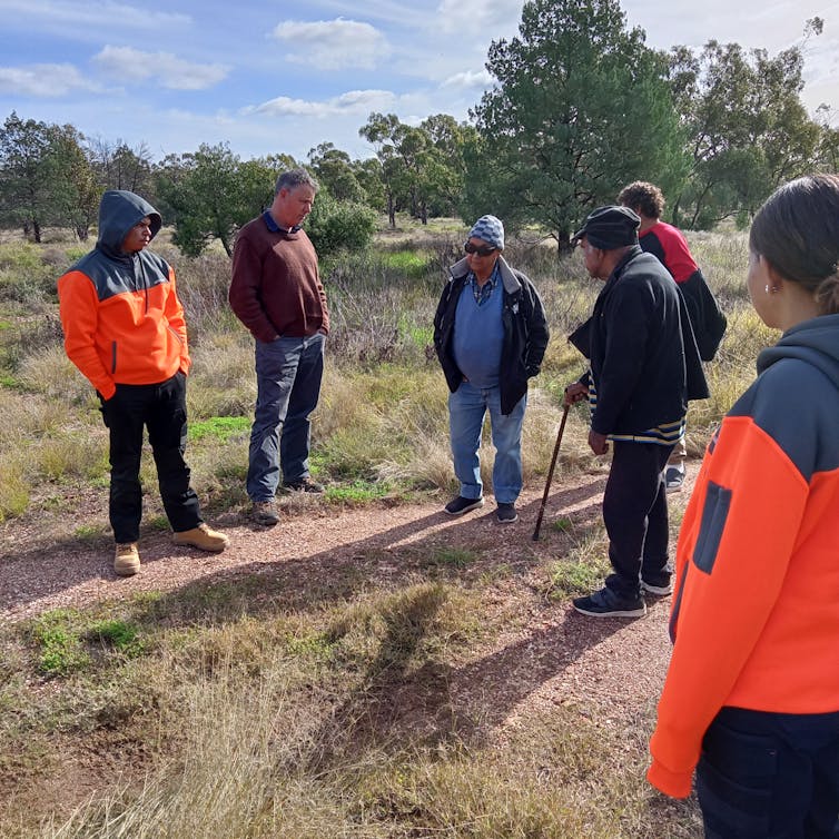 Uncle Clem Dodd and Uncle Louie Beale tell story of Galigurrunhaa Spring to a local ranger team.