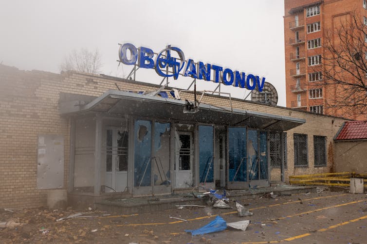 Damaged building with Antonov sign.