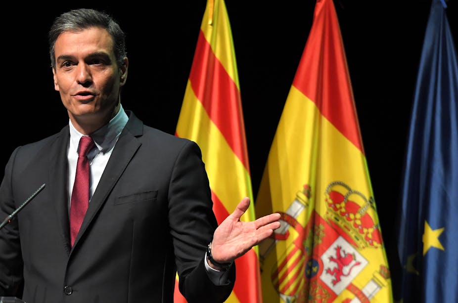 Pedro Sánchez stands by the Catalan, Spanish and European flags, at a meeting in Barcelona in 2021.