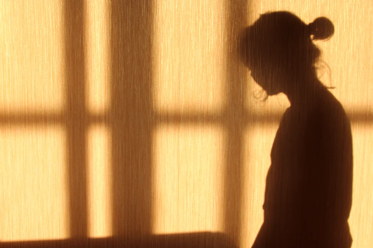 A woman's shadow on a wall