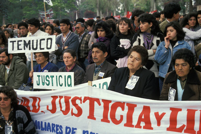 Rows of men, women and children protesting in Santiago, Chile