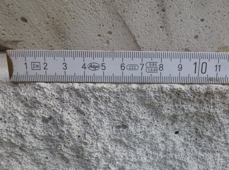 A cross-section of an aerated concrete block.