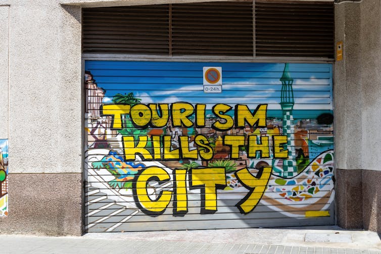 Graffiti on a shutter that says
