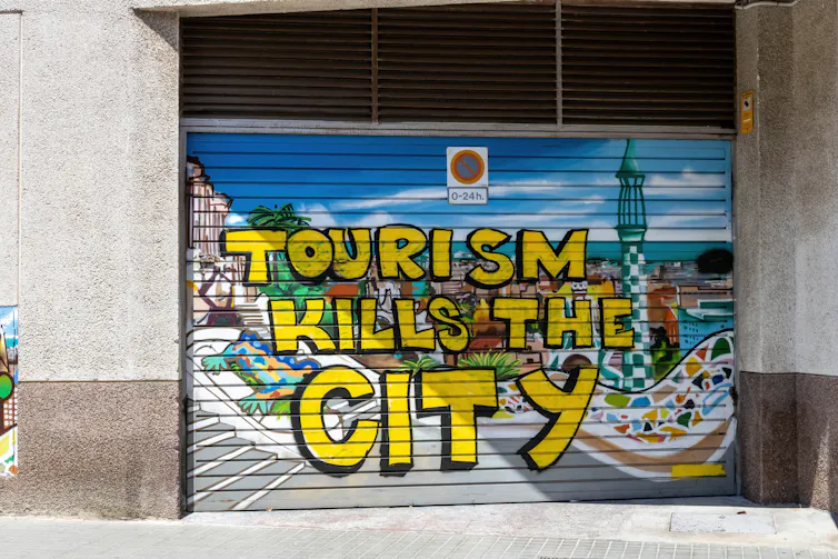 Graffiti on a shutter that says
