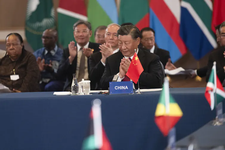 Chinese president Xi Jinping applauds a speaker at he China-Africa Leaders' roundtable dialogue at the recent Brics summit in Johannesburg.