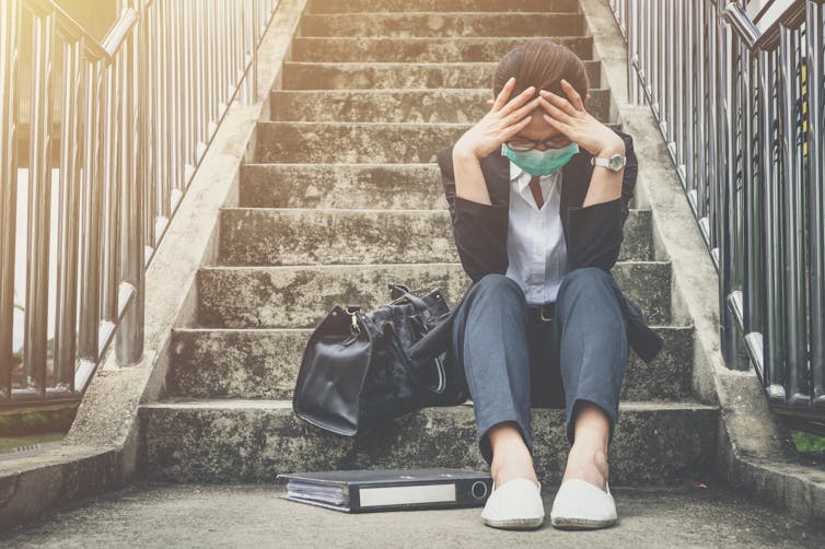 A woman looks very stressed.