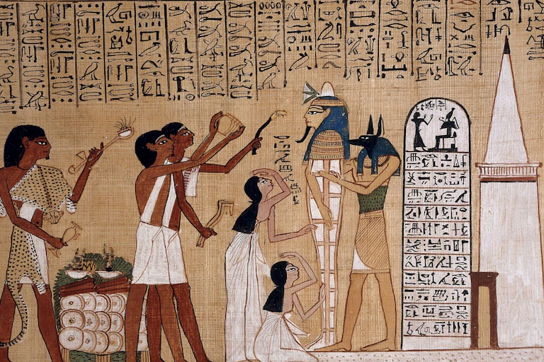 Egyptian art showing people waving objects at a sarcophagus.