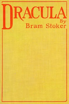 yellow book jacket with red inscription