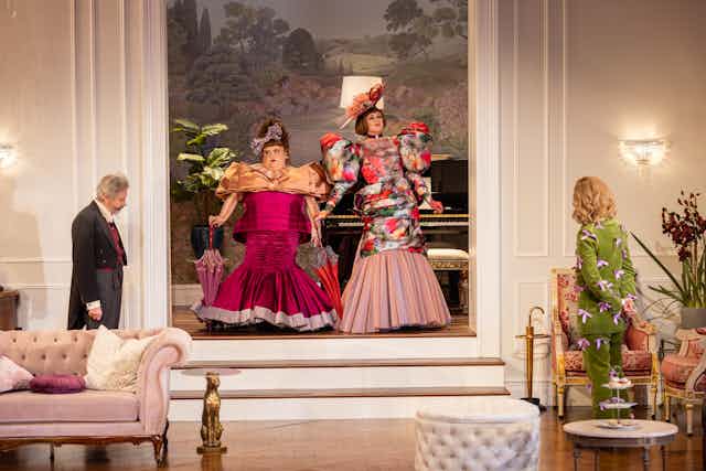 Production image: two outrageously dressed women