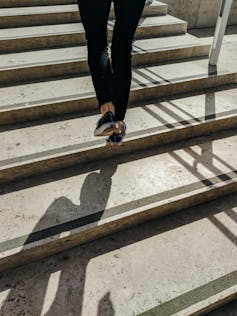 Person walks up steps