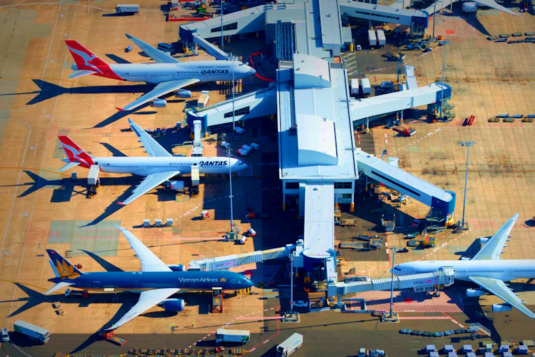 Aerial view of planes docked at a terminal